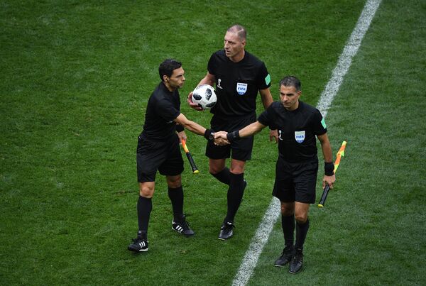 Referees shake hands during the World Cup Group A soccer match between Russia and Saudi Arabia at the Luzhniki stadium in Moscow, Russia, June 14, 2018. Referees shake hands during the World Cup Group A soccer match between Russia and Saudi Arabia at the Luzhniki stadium in Moscow, Russia, June 14, 2018. - Sputnik International