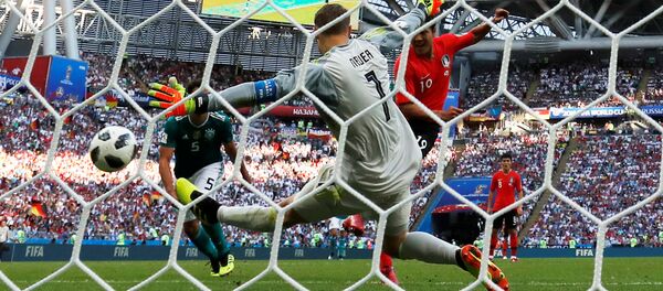 Soccer Football - World Cup - Group F - South Korea vs Germany - Kazan Arena, Kazan, Russia - June 27, 2018 South Korea's Kim Young-gwon scores their first goal past Germany's Manuel Neuer - Sputnik International