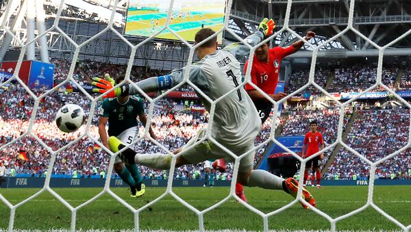 Soccer Football - World Cup - Group F - South Korea vs Germany - Kazan Arena, Kazan, Russia - June 27, 2018 South Korea's Kim Young-gwon scores their first goal past Germany's Manuel Neuer - Sputnik International