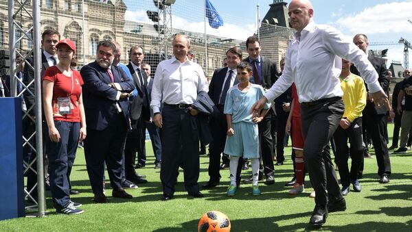 June 28, 2018. Russian President Vladimir Putin and FIFA president Gianni Infantino, right, visit the themed 2018 FIFA World Cup Football Park on Red Square - Sputnik International