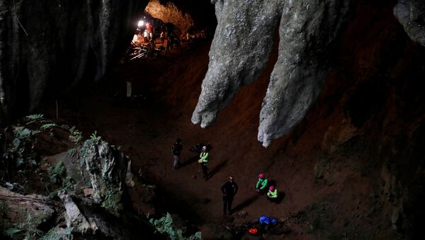 Rescue workers are seen in Tham Luang caves during a search for 12 members of an under-16 soccer team and their coach, in the northern province of Chiang Rai, Thailand, June 27, 2018. - Sputnik International