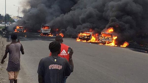 Smoke rises above the cars in fire on a street in Lagos, Nigeria, June 28, 2018 in this picture obtained from social media - Sputnik International
