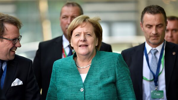 German Chancellor Angela Merkel arrives at a European People's Party (EPP) meeting ahead of a EU summit in Brussels, Belgium June 28, 2018 - Sputnik International