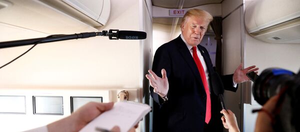 U.S. President Donald Trump speaks to the press aboard Air Force One en route to Bedminster, New Jersey, from Joint Base Andrews, Maryland, U.S., June 29, 2018 - Sputnik International