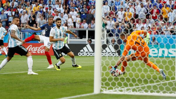 Soccer Football - World Cup - Round of 16 - France vs Argentina - Kazan Arena, Kazan, Russia - June 30, 2018 France's Kylian Mbappe scores their third goal - Sputnik International