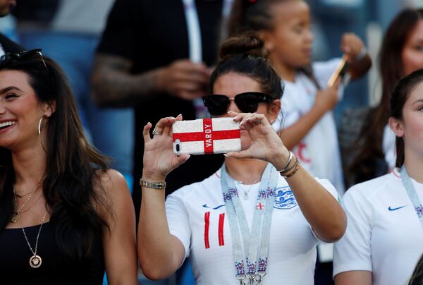World Cup - Group G - England vs Belgium - Kaliningrad Stadium, Kaliningrad, Russia - June 28, 2018 Rebekah Vardy, wife of England's Jamie Vardy, takes a photo in the stands - Sputnik International