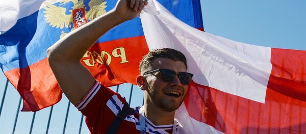 A soccer fan cheers waiting for the start of the World Cup Group G soccer match between Tunisia and England in Volgograd, Russia, June 18, 2018 A soccer fan cheers waiting for the start of the World Cup Group G soccer match between Tunisia and England in Volgograd, Russia, June 18, 2018 - Sputnik International