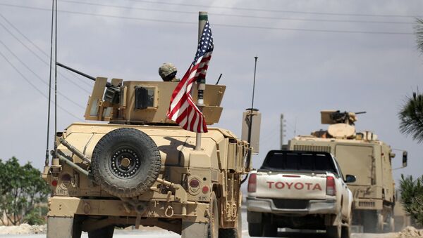 The U.S. flag flutters on a military vehicle in Manbij countryside, Syria May 12, 2018 - Sputnik International