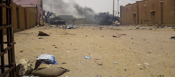 Smoke billows from an army armoured vehicle in Gao after and explosion on July 1, 2018 - Sputnik International