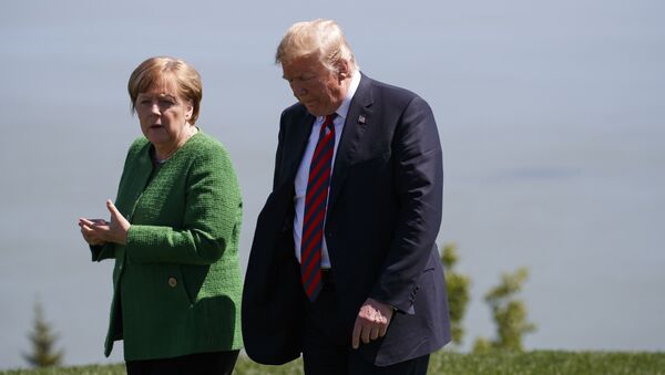President Donald Trump, right, talks with German Chancellor Angela Merkel after the family photo during the G7 Summit, Friday, June 8, 2018, in Charlevoix, Canada - Sputnik International