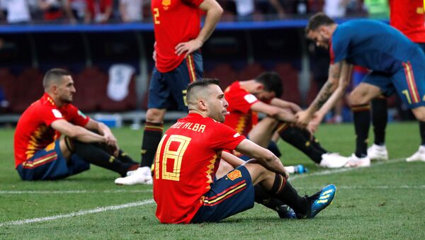 Soccer Football - World Cup - Round of 16 - Spain vs Russia - Luzhniki Stadium, Moscow, Russia - July 1, 2018 Spain's Jordi Alba and team mates look dejected after the match - Sputnik International