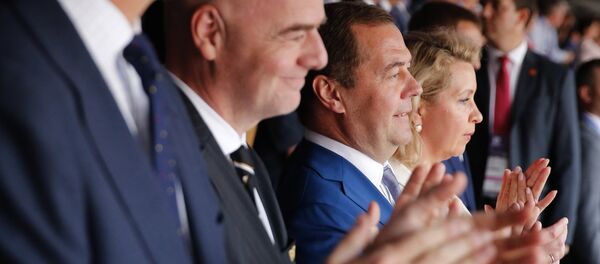 Russian Prime Minister Dmitry Medvedev and his wife Svetlana during the match of the World Cup 1/8 finals between Spain and Russia. - Sputnik International