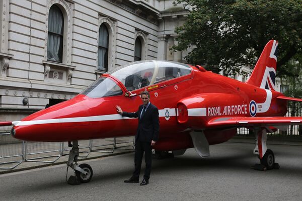 Britain's Defence Secretary Gavin Williamson poses alongside a replica British Royal Air Force's (RAF) Red Arrows BAE Hawk aircraft outside numbers 10 and 11 Downing Street in central London on May 23, 2018, as part of the RAF's 2018 centenary celebrations Britain's Defence Secretary Gavin Williamson poses alongside a replica British Royal Air Force's (RAF) Red Arrows BAE Hawk aircraft outside numbers 10 and 11 Downing Street in central London on May 23, 2018, as part of the RAF's 2018 centenary celebrations - Sputnik International