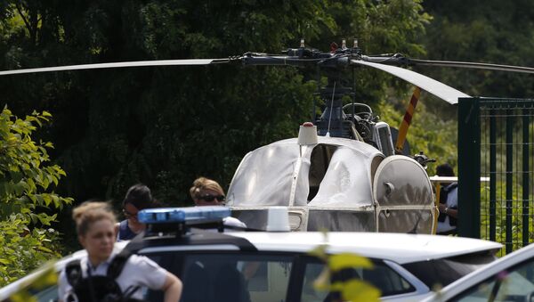 This picture taken on July 1, 2018 in Gonesse, north of Paris shows police near a French helicopter Alouette II abandoned by French armed robber Redoine Faid after his escape from prison in Reau - Sputnik International