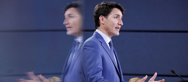 Canada's Prime Minister Justin Trudeau is reflected in a monitor while speaking during a news conference in Ottawa, Ontario, Canada, June 20, 2018 Canada's Prime Minister Justin Trudeau is reflected in a monitor while speaking during a news conference in Ottawa, Ontario, Canada, June 20, 2018 - Sputnik International