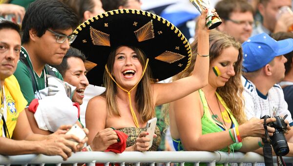 Mexico's fans cheer waiting for the start of the World Cup Round of 16 soccer match between Brazil and Mexico, in Samara, Russia, July 2, 2018 - Sputnik International