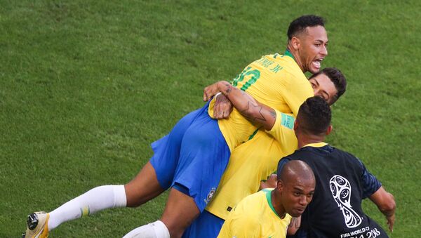 Brazil's Neymar, left, and Brazil's Roberto Firmino celebrate a goal during the World Cup Round of 16 soccer match between Brazil and Mexico at the Samara Arena, in Samara, Russia, July 2, 2018 - Sputnik International