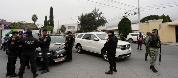 Police officers and soldiers gather near the Colegio Americano del Noreste after a student opened fire at the American school in Monterrey, Mexico Police officers and soldiers gather near the Colegio Americano del Noreste after a student opened fire at the American school in Monterrey, Mexico - Sputnik International