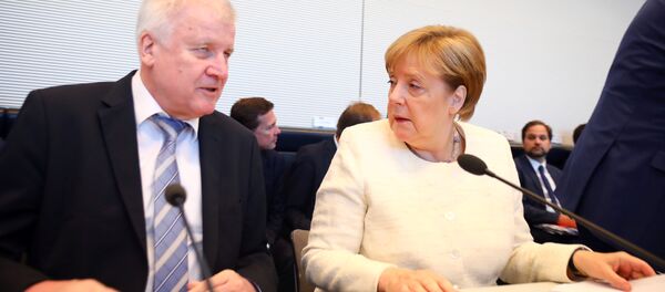 German Chancellor Angela Merkel and Interior Minister Horst Seehofer arrive for a CDU/CSU fraction meeting in Berlin, Germany, July 3, 2018 German Chancellor Angela Merkel and Interior Minister Horst Seehofer arrive for a CDU/CSU fraction meeting in Berlin, Germany, July 3, 2018 - Sputnik International