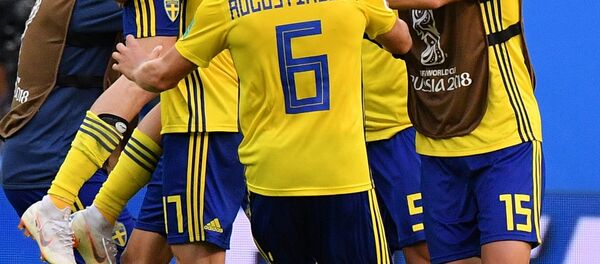 Soccer Football - World Cup - Round of 16 - Sweden vs Switzerland - Saint Petersburg Stadium, Saint Petersburg, Russia - July 3, 2018 Sweden's Oscar Hiljemark and team mates celebrate after the match Soccer Football - World Cup - Round of 16 - Sweden vs Switzerland - Saint Petersburg Stadium, Saint Petersburg, Russia - July 3, 2018 Sweden's Oscar Hiljemark and team mates celebrate after the match - Sputnik International
