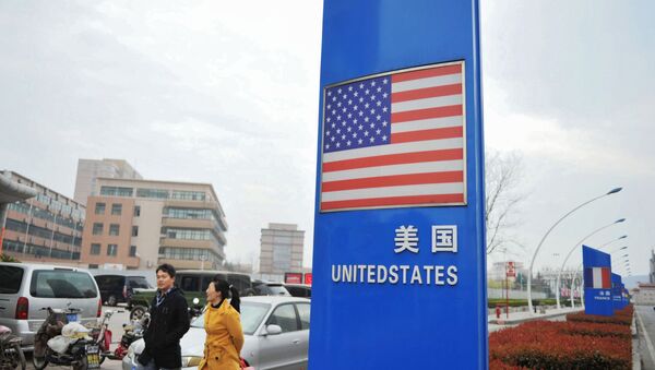 This file picture taken on April 5, 2018 shows a sign with a US flag outside a supermarket selling foreign goods in Qingdao, in China's eastern Shandong province - Sputnik International
