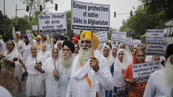 Indian Sikhs hold placards as they march toward Afghanistan embassy during a protest in New Delhi, India, Tuesday, July 3, 2018 - Sputnik International