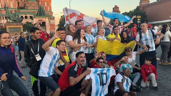 Football fans near the Saint Basil's Cathedral in the Red Square in Moscow - Sputnik International