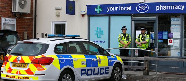 Police officers guard outside a branch of Boots pharmacy, which has been cordoned off after two people were hospitalised and police declared a 'major incident', in Amesbury, Wiltshire, Britain, July 4, 2018 Police officers guard outside a branch of Boots pharmacy, which has been cordoned off after two people were hospitalised and police declared a 'major incident', in Amesbury, Wiltshire, Britain, July 4, 2018 - Sputnik International