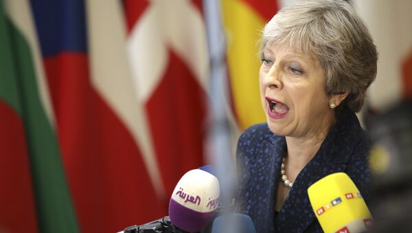 British Prime Minister Theresa May speaks with the media as she arrives for an EU summit at the Europa building in Brussels, Thursday, June 28, 2018. - Sputnik International