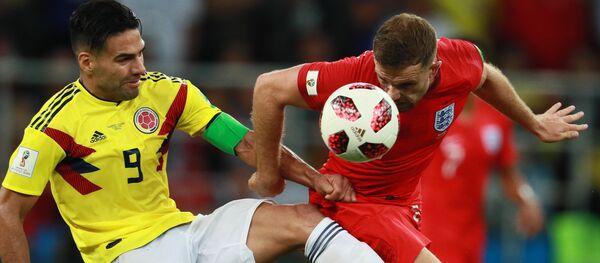 Colombia's Radamel Falcao, left, struggles for a ball with unidentified England's player during extra time of the World Cup Round of 16 soccer match between Colombia and England, at the Spartak Arena, in Moscow, Russia, July 3, 2018. - Sputnik International