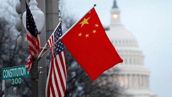 FILE PHOTO: The People's Republic of China flag and the U.S. Stars and Stripes fly on a lamp post along Pennsylvania Avenue near the U.S. Capitol - Sputnik International