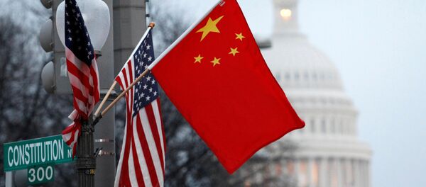 FILE PHOTO: The People's Republic of China flag and the U.S. Stars and Stripes fly on a lamp post along Pennsylvania Avenue near the U.S. Capitol - Sputnik International