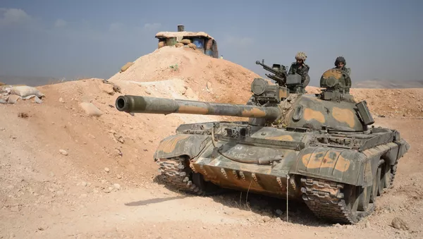 The crew of a T-72 tank of the 10th Division, 2nd Corps of the Syrian Arab Army are on combat alert off Katana, Damascus Province - Sputnik International