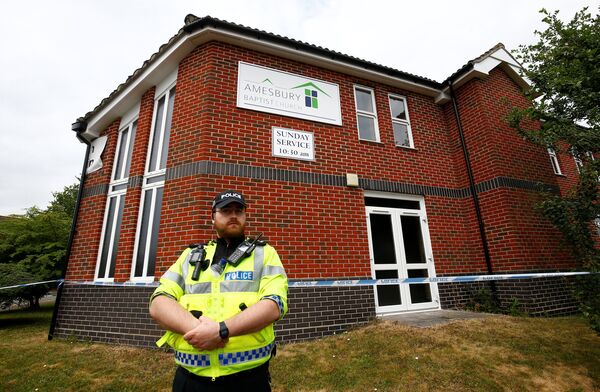 A police officer stands in front of Amesbury Baptist Church, which has been cordoned off after two people were hospitalised and police declared a 'major incident', in Amesbury, Wiltshire, Britain, July 4, 2018 A police officer stands in front of Amesbury Baptist Church, which has been cordoned off after two people were hospitalised and police declared a 'major incident', in Amesbury, Wiltshire, Britain, July 4, 2018 - Sputnik International