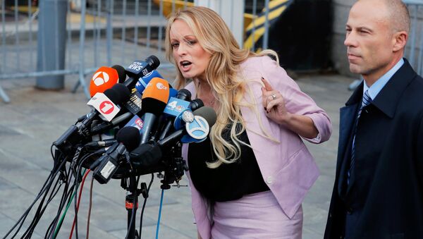 FILE PHOTO: Adult film actress Stephanie Clifford, also known as Stormy Daniels, speaks to media along with lawyer Michael Avenatti (R) outside federal court in the Manhattan borough of New York City, New York, U.S., April 16, 2018 - Sputnik International