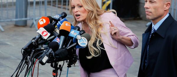 FILE PHOTO: Adult film actress Stephanie Clifford, also known as Stormy Daniels, speaks to media along with lawyer Michael Avenatti (R) outside federal court in the Manhattan borough of New York City, New York, U.S., April 16, 2018 FILE PHOTO: Adult film actress Stephanie Clifford, also known as Stormy Daniels, speaks to media along with lawyer Michael Avenatti (R) outside federal court in the Manhattan borough of New York City, New York, U.S., April 16, 2018 - Sputnik International