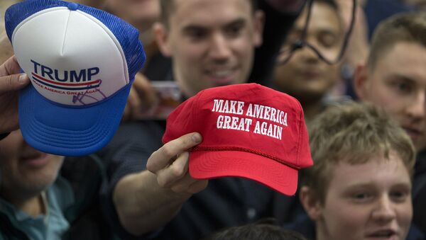 Supporters hold out their hats to get them autographed by Republican presidential candidate Donald Trump at a rally Sunday, Jan. 31, 2016, in Council Bluffs, Iowa - Sputnik International