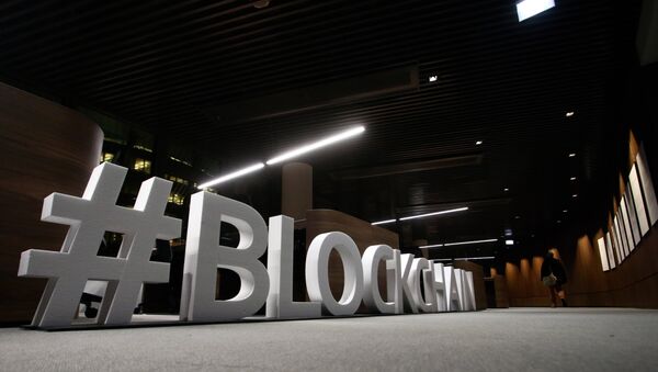 Giant letters, reading the word blockchain are displayed at the blockchain centre, which aims at boosting start-ups, on February 7, 2018 in Lithuania's capital Vilnius - Sputnik International