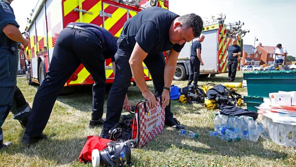 Fire and Rescue Service personel prepare safety equipment at the site of a housing estate on Muggleton Road, after it was confirmed that two people had been poisoned with the nerve-agent Novichok, in Amesbury, Britain, July 6, 2018. - Sputnik International