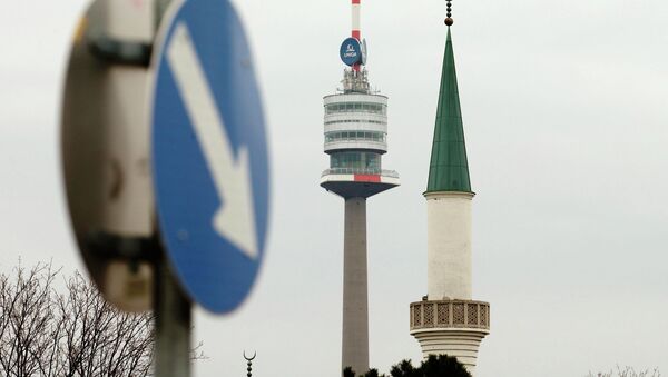A minaret of the Islamic Centre mosque is pictured next to the Donauturm tower in Vienna - Sputnik International
