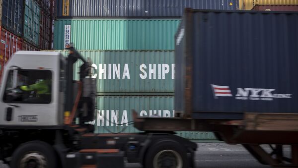 In this Thursday, July, 5, 2018 photo, a jockey truck passes a stack of 40-foot China Shipping containers at the Port of Savannah in Savannah, Ga. - Sputnik International