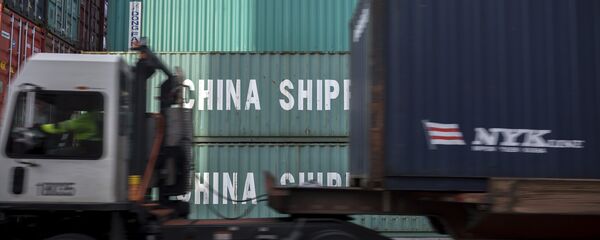 In this Thursday, July, 5, 2018 photo, a jockey truck passes a stack of 40-foot China Shipping containers at the Port of Savannah in Savannah, Ga. In this Thursday, July, 5, 2018 photo, a jockey truck passes a stack of 40-foot China Shipping containers at the Port of Savannah in Savannah, Ga. - Sputnik International