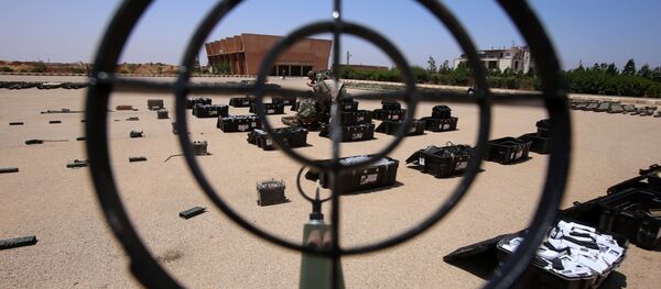 Syrian government forces' soldiers display weapons confiscated from the rebels in a Syrian army military base in the town of Ezraa, province of Daraa, on July 4, 2018 - Sputnik International
