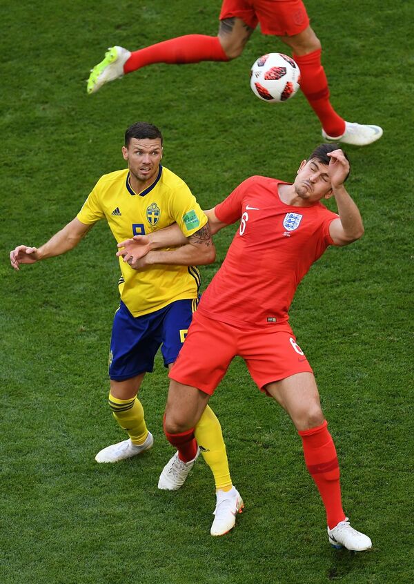 Sweden's Marcus Berg, left, and England's Harry Maguire struggle for a ball during the World Cup quarterfinal soccer match between Sweden and England, at the Samara Arena, in Samara, Russia, July 7, 2018 Sweden's Marcus Berg, left, and England's Harry Maguire struggle for a ball during the World Cup quarterfinal soccer match between Sweden and England, at the Samara Arena, in Samara, Russia, July 7, 2018 - Sputnik International
