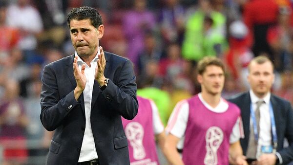Dejected Spain's head coach Fernando Hierro leaves a pitch after team's loss at the World Cup Round of 16 soccer match between Spain and Russia at the Luzhniki stadium in Moscow, Russia, July 1, 2018 - Sputnik International