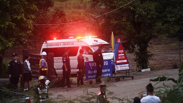 An ambulance leave the Tham Luang cave area after divers evacuated some of the 12 boys and their coach trapped at the cave in Khun Nam Nang Non Forest Park in the Mae Sai district of Chiang Rai province on July 8, 2018 - Sputnik International