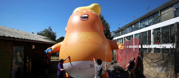 People inflate a helium filled Donald Trump blimp which they hope to deploy during The President of the United States' upcoming visit, in London, Britain, June 26, 2018 People inflate a helium filled Donald Trump blimp which they hope to deploy during The President of the United States' upcoming visit, in London, Britain, June 26, 2018 - Sputnik International