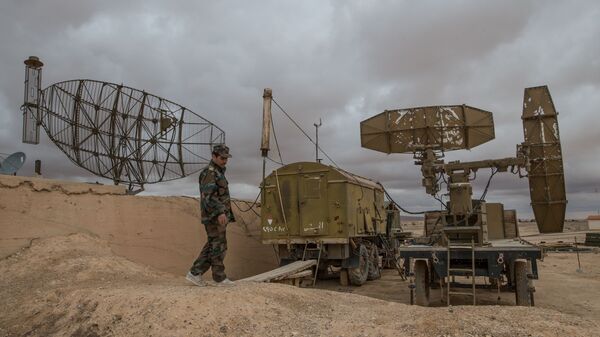 A Syrian army soldier inspects radar equipment at the Syrian Air Force base in Homs - Sputnik International