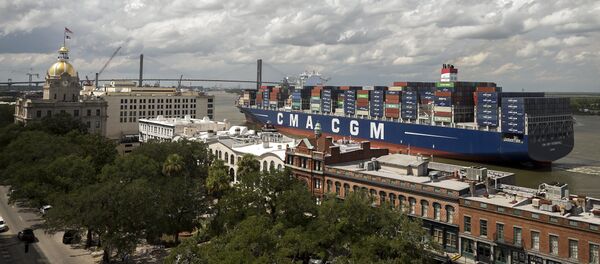 The 14,000 TEU container ship CMA CGM Theodore Roosevelt sails up river past River Street in Savannah, Georgia - Sputnik International