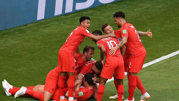 England's players celebrate their team's goal during the World Cup quarterfinal soccer match between Sweden and England, at the Samara Arena, in Samara, Russia, July 7, 2018 - Sputnik International